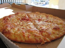 A 10" cheese pizza. Krazy Karl's offers many options when it comes to cheese, including feta, ricotta and cream cheese.